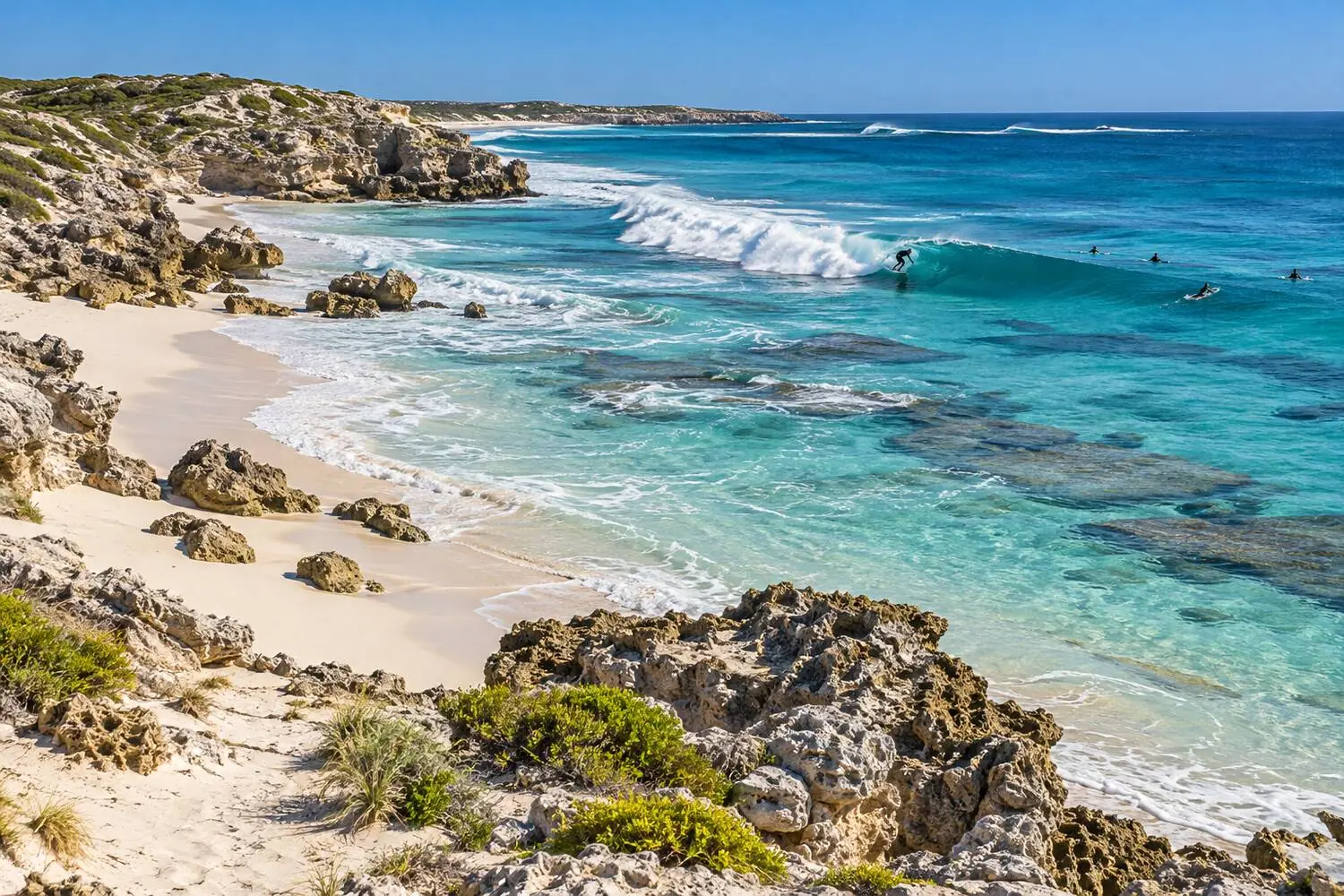 Afternoon beach-break peaks rolling into the sand at Trigg Beach, Western Australia